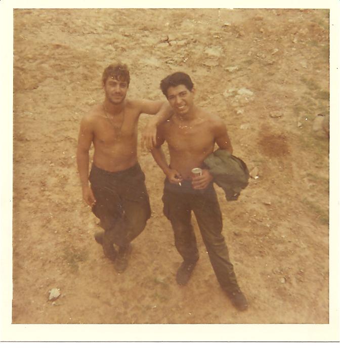 A buddy named Chuck and me near an airstrip